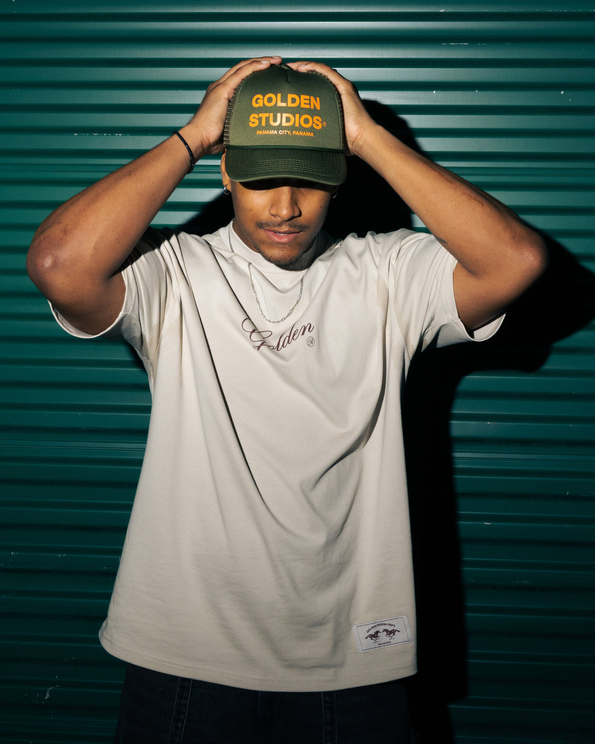 GA® Golden Studios Trucker Hat Olive — editorial styling and fit reference