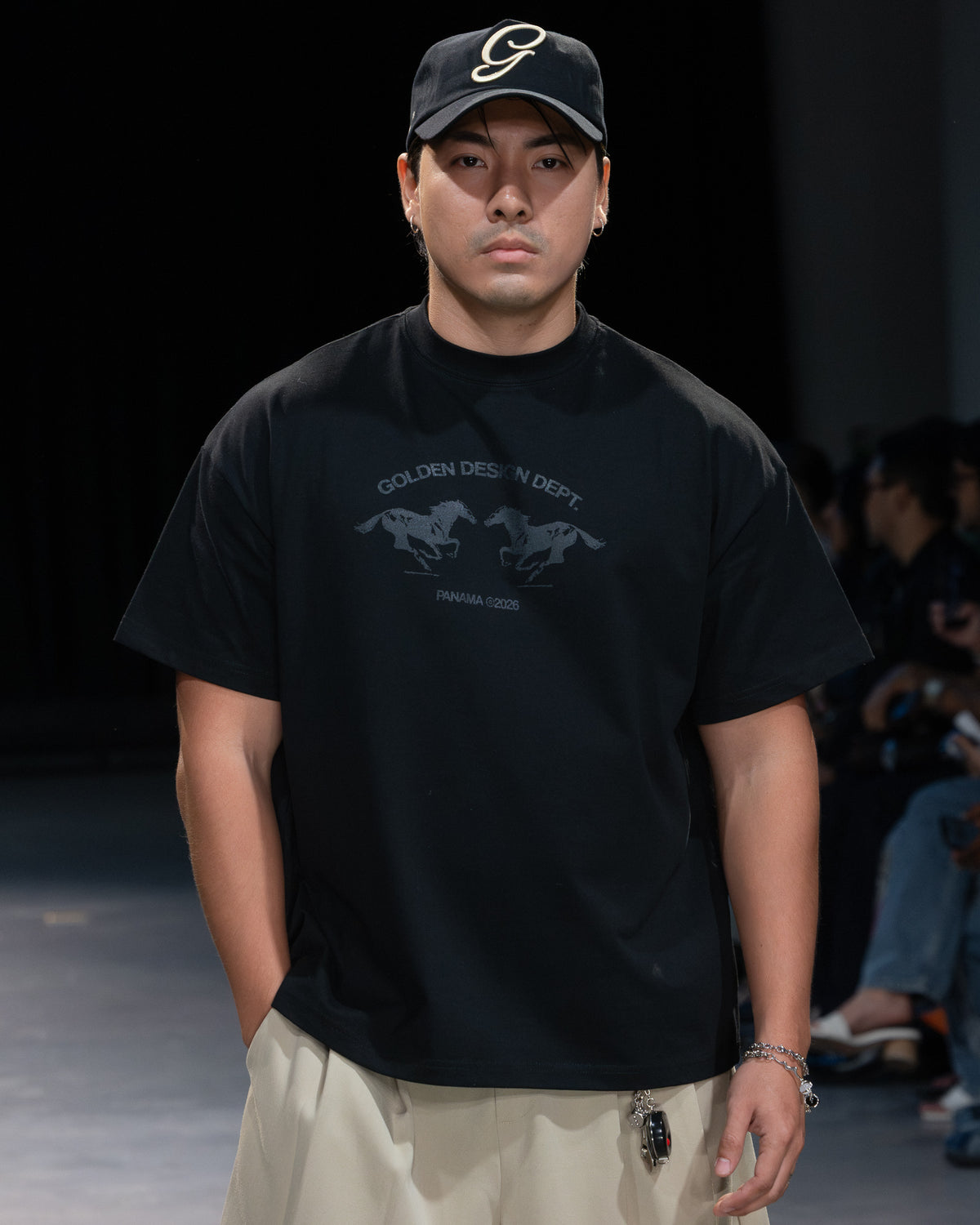 Golden Angels runway: Close-up of a black Golden Angels graphic tee and embroidered cap