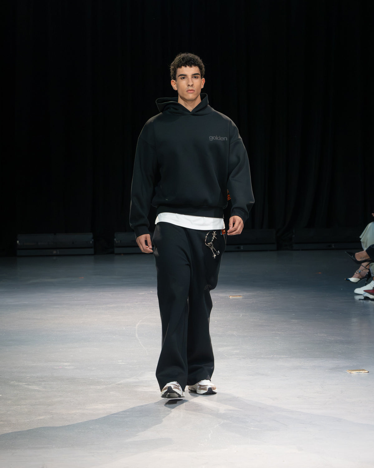 Look 01 — Black hoodie, Golden Angels runway